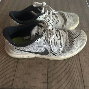 Used and well worn women’s Nike Free running sneakers, size 7